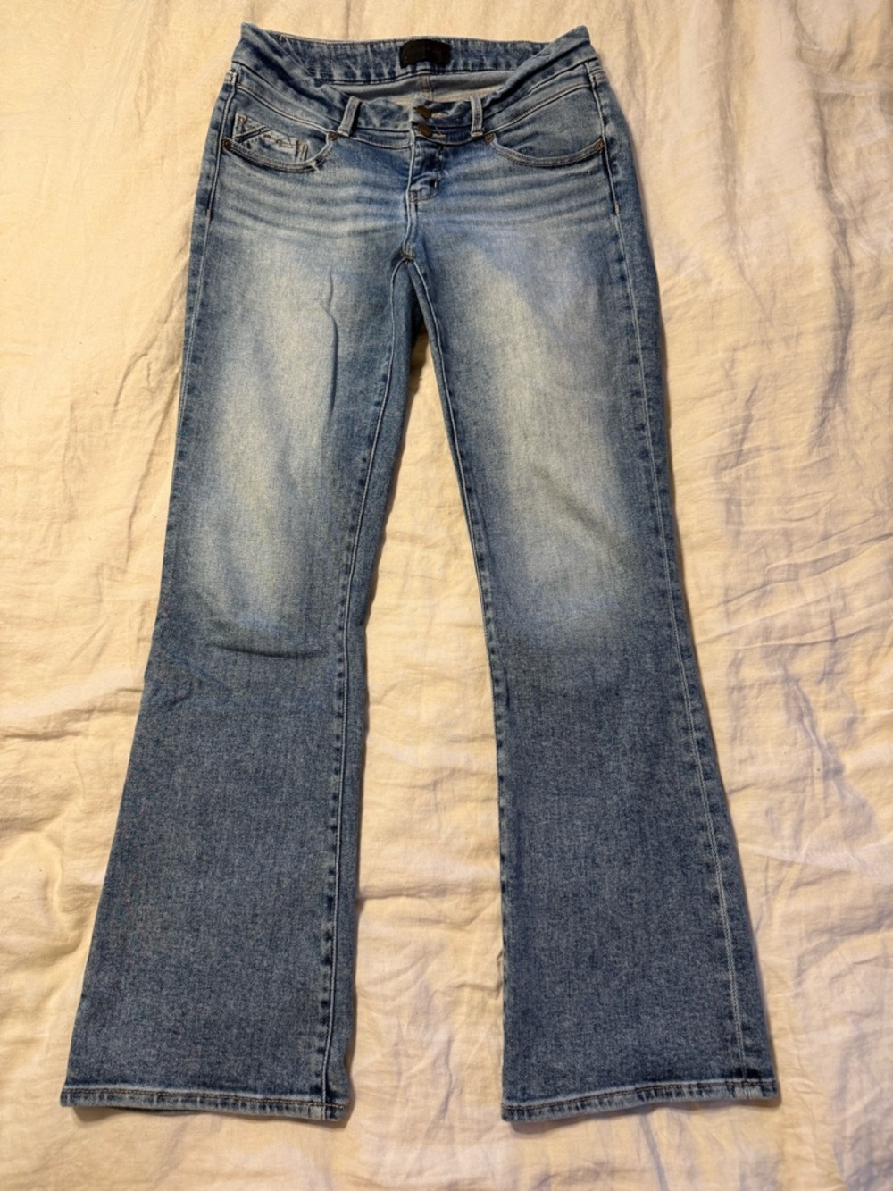 Buckle Light Wash Flare Jeans in Blue